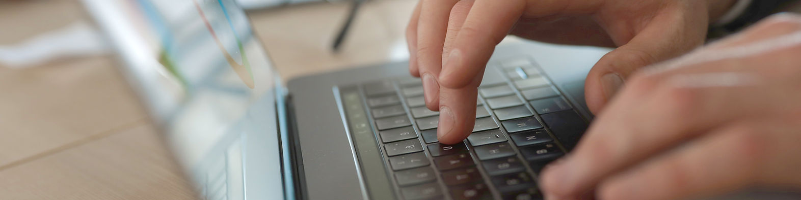 Businessman typing on laptop